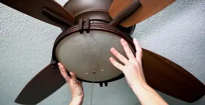 Ceiling fan repair and reinstallation on ceiling mount in Louisville, KY