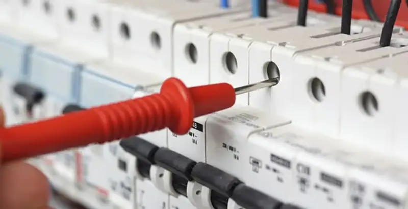 Electrical contractor testing circuit breakers during electrical repair in New Albany, IN