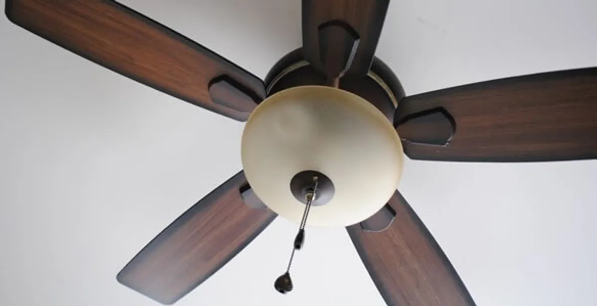 Fully installed ceiling fan with balanced blades and light fixture in Louisville, KY