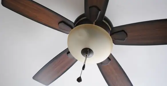 Fully installed ceiling fan with balanced blades and light fixture in Louisville, KY