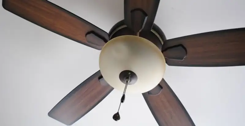 Fully installed ceiling fan with balanced blades and light fixture in Louisville, KY