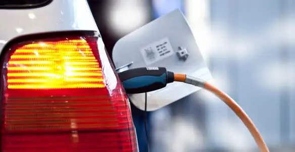 Electric car plugged into EV charger after professional installation in Louisville, KY