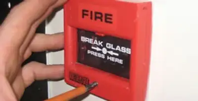 fire alarm installation service showing manual fire alarm pull station installed by licensed electricians in Louisville, KY