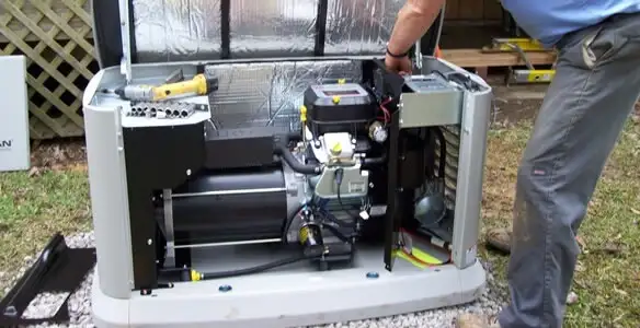 generator installation service showing technician connecting and configuring generator components in Louisville, KY