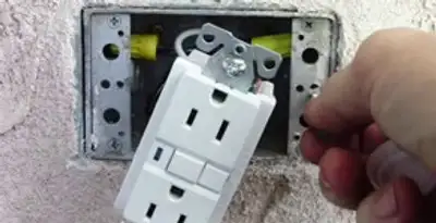 gfci circuits service showing installation of a ground fault circuit interrupter outlet by licensed electricians in Louisville, KY