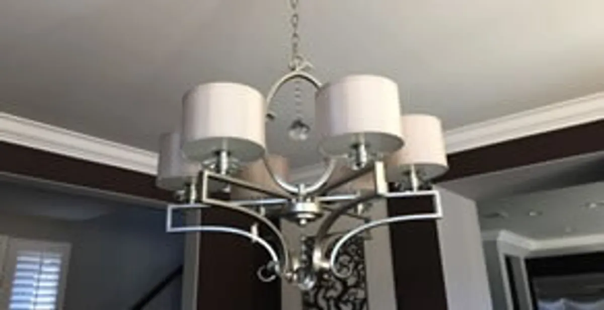 Modern chandelier installation with multiple light fixtures in Louisville, KY