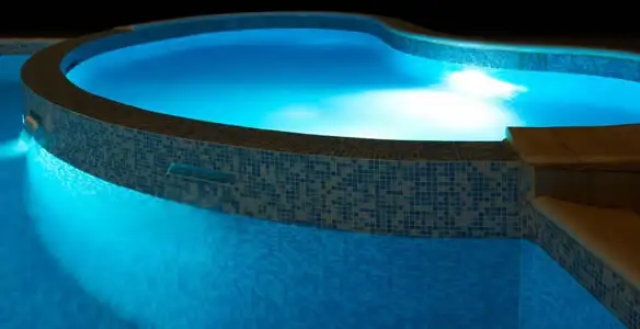 pool light installation and repair services highlighting illuminated pool interior lighting in Louisville, KY