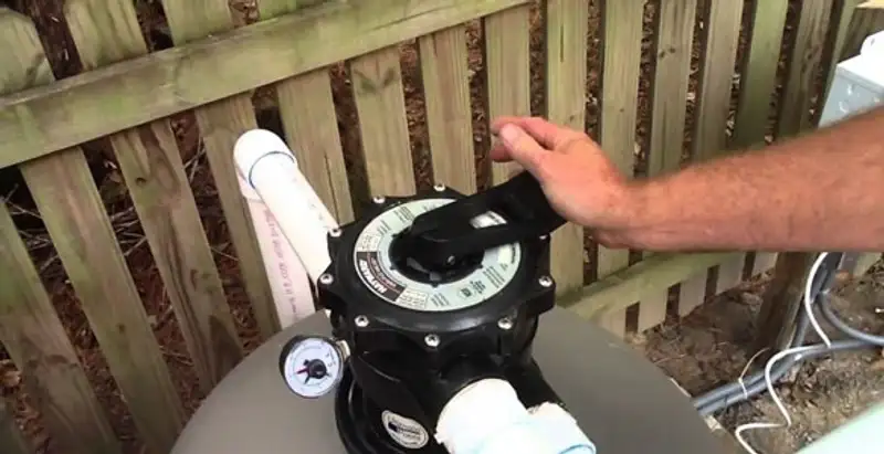 pool pumps service showing professional adjustment of pool pump control system in Louisville, KY
