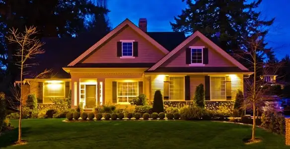 security light installation services illuminating a residential exterior at night in Louisville, KY