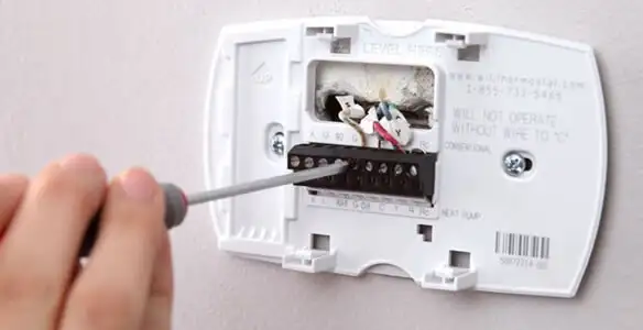 Thermostat installation service with proper wiring and secure wall mounting in Louisville, KY
